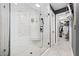 Modern bathroom featuring a glass-enclosed shower with a built-in seat and a walk-in closet at 4527 Village Springs Run, Dunwoody, GA 30338