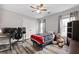 Comfortable bedroom features a ceiling fan, hardwood floors, and neutral paint at 4527 Village Springs Run, Dunwoody, GA 30338