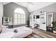 Bright bedroom with vaulted ceiling, hardwood floors, white accents, and ample natural light at 4527 Village Springs Run, Dunwoody, GA 30338