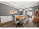Elegant dining room with hardwood floors, modern lighting, and stylish decor at 4527 Village Springs Run, Dunwoody, GA 30338