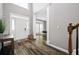 Welcoming foyer with hardwood floors and natural light streaming through the windows at 4527 Village Springs Run, Dunwoody, GA 30338