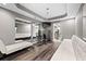 Spacious finished basement gym area with hardwood floors and a large mirror at 4527 Village Springs Run, Dunwoody, GA 30338