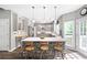 Beautiful kitchen with stone island, hardwood floors, stainless appliances, and ample cabinet space at 4527 Village Springs Run, Dunwoody, GA 30338