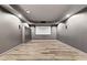Finished basement theater room with hardwood floors and projector screen at 4527 Village Springs Run, Dunwoody, GA 30338