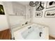 Modern bathroom with a soaking tub, stylish fixtures, and artistic wall decor, creating a spa-like retreat at 110 Serenity Pl, Fayetteville, GA 30214