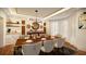 Elegant dining room featuring a stylish table set, modern lighting, and decorative accents at 110 Serenity Pl, Fayetteville, GA 30214