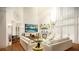 Bright and airy living room with modern decor, fireplace, hardwood floors, and large windows at 110 Serenity Pl, Fayetteville, GA 30214