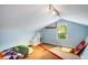 Attic space with a window, storage, and a stop sign leaning against the wall at 1367 Ormewood Se Ave, Atlanta, GA 30316