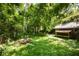 Backyard featuring a spacious lawn area with a storage shed and mature trees at 1367 Ormewood Se Ave, Atlanta, GA 30316