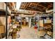 Unfinished basement with exposed ceiling, storage shelves, and concrete floor, offering ample space for customization at 1367 Ormewood Se Ave, Atlanta, GA 30316