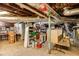 Unfinished basement featuring exposed pipes and wooden beams, offering potential for future renovations and storage at 1367 Ormewood Se Ave, Atlanta, GA 30316