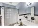 Bathroom with tiled shower and classic fixtures and vanity at 1367 Ormewood Se Ave, Atlanta, GA 30316