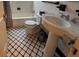 Bathroom with checkerboard tile and pedestal sink at 1367 Ormewood Se Ave, Atlanta, GA 30316