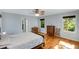 Bright bedroom with hardwood floors, ceiling fan, and multiple windows offering scenic views at 1367 Ormewood Se Ave, Atlanta, GA 30316