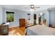 Bedroom showcasing hardwood floors, a window, and a closet with ample storage space at 1367 Ormewood Se Ave, Atlanta, GA 30316