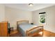 Bright bedroom featuring hardwood floors, a window, and simple furniture at 1367 Ormewood Se Ave, Atlanta, GA 30316