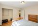 Cozy bedroom featuring hardwood floors, a closet, and simple design at 1367 Ormewood Se Ave, Atlanta, GA 30316