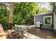Inviting wooden deck with outdoor seating, grill, and string lights, perfect for relaxing and entertaining guests at 1367 Ormewood Se Ave, Atlanta, GA 30316