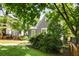 Landscaped yard surrounding a gray home with white trim at 1367 Ormewood Se Ave, Atlanta, GA 30316