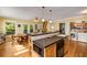 Bright eat-in kitchen features a large island with a microwave and hardwood floors at 1367 Ormewood Se Ave, Atlanta, GA 30316