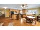 Eat-in kitchen with wooden cabinets, hardwood floors, stainless steel appliances, and central island at 1367 Ormewood Se Ave, Atlanta, GA 30316