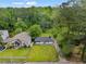 Aerial view of a well-maintained home with a manicured lawn and mature trees at 2049 Rector Sw Dr, Atlanta, GA 30311