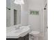 Bathroom featuring a large sink, shower and a window providing natural light at 2049 Rector Sw Dr, Atlanta, GA 30311