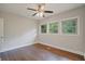 Bedroom with hardwood floors, ceiling fan and three windows providing natural light at 2049 Rector Sw Dr, Atlanta, GA 30311