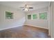 Bedroom with windows letting in natural light, hardwood floors, and a ceiling fan at 2049 Rector Sw Dr, Atlanta, GA 30311