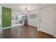 This wide-open kitchen offers stainless steel appliances, white cabinetry, and hardwood floors at 2049 Rector Sw Dr, Atlanta, GA 30311