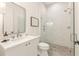 Modern bathroom boasts a glass-enclosed shower, white vanity, and stylish fixtures at 370 2Nd St, Fayetteville, GA 30214