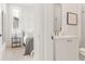 Bathroom with white vanity, framed mirror, glass enclosed shower, and decorative tile flooring at 370 2Nd St, Fayetteville, GA 30214