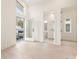 Bright and spacious bedroom with balcony, hardwood floors, and entry to a white-tiled bathroom at 370 2Nd St, Fayetteville, GA 30214