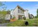 Stylish modern home with eye-catching architecture, bright exterior, and a landscaped front yard at 370 2Nd St, Fayetteville, GA 30214