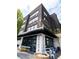 Stylish Gelato shop exterior with an artful mural, outdoor seating, and sleek architectural design, creating a welcoming facade at 370 2Nd St, Fayetteville, GA 30214