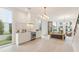 Modern kitchen with stainless steel appliances, stone backsplash, and an open layout to the living area at 370 2Nd St, Fayetteville, GA 30214