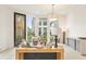 Well-lit living area with large windows, hardwood floors, and modern décor elements at 370 2Nd St, Fayetteville, GA 30214