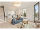 Open living space with hardwood floors, stylish furniture, and an adjacent modern kitchen at 370 2Nd St, Fayetteville, GA 30214