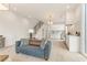 Open-concept living space featuring a modern kitchen, staircase, and stylish furnishings at 370 2Nd St, Fayetteville, GA 30214