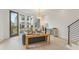 Bright and airy living room featuring large windows, contemporary furnishings, and hardwood floors, creating an inviting space at 370 2Nd St, Fayetteville, GA 30214