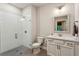 Modern bathroom featuring a glass-enclosed shower with white subway tile and sleek vanity with marble countertop at 4355 Parkside Pl, Sandy Springs, GA 30342