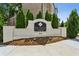 An inviting entrance to The Townes at Chastain community with professional landscaping at 4355 Parkside Pl, Sandy Springs, GA 30342