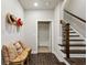 Inviting entryway with decorative hats, staircase, and a quaint bench, blending style and function at 4355 Parkside Pl, Sandy Springs, GA 30342