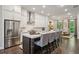Modern kitchen with white cabinets, stainless steel appliances, and island seating for four at 4355 Parkside Pl, Sandy Springs, GA 30342
