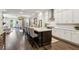 Open-concept kitchen with hardwood floors, a large island, and a view into the living area at 4355 Parkside Pl, Sandy Springs, GA 30342