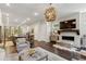 Spacious living room with fireplace, dark hardwood floors and an ornamental chandelier at 4355 Parkside Pl, Sandy Springs, GA 30342