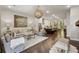 Open-concept living space flows into a modern kitchen with an island and bar seating at 4355 Parkside Pl, Sandy Springs, GA 30342