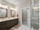 The main bathroom includes a double vanity, frameless glass shower, and marble floors at 4355 Parkside Pl, Sandy Springs, GA 30342