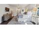 The main bedroom includes dark hardwood floors and decorative accents, enhancing the room's bright and stylish ambiance at 4355 Parkside Pl, Sandy Springs, GA 30342
