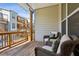 Private outdoor patio features cozy wicker seating and a view of the surrounding community at 4355 Parkside Pl, Sandy Springs, GA 30342